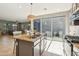 Bright kitchen featuring stainless steel appliances and granite countertops with views to the Gathering room at 4712 E Bonanza Rd, Gilbert, AZ 85297