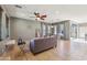 Inviting living room featuring tile flooring, ample natural light, and stylish furnishings at 4712 E Bonanza Rd, Gilbert, AZ 85297