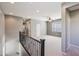 Spacious loft area with neutral carpet, ceiling fan, and plenty of natural light at 4712 E Bonanza Rd, Gilbert, AZ 85297