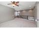 Spacious loft area with gray walls, plush carpet, iron railing, and ample natural light at 4712 E Bonanza Rd, Gilbert, AZ 85297