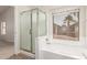 Modern bathroom featuring a separate tub and shower with a window view at 515 E Sherri Dr, Gilbert, AZ 85296