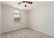 Bedroom featuring carpeted floors, arched window and neutral colored walls at 515 E Sherri Dr, Gilbert, AZ 85296