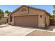 Single story home featuring a two car garage and neutral color palette at 515 E Sherri Dr, Gilbert, AZ 85296