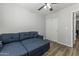 Bedroom with a blue sleeper sofa, a window, and a closet at 5421 W Burton Dr, Phoenix, AZ 85043