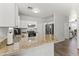 Efficient kitchen design with granite counters, white cabinets and stainless steel appliances at 5421 W Burton Dr, Phoenix, AZ 85043