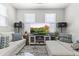 Inviting living room featuring comfortable sofas, a flat-screen TV, and stylish decor at 5421 W Burton Dr, Phoenix, AZ 85043