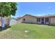 Expansive backyard with lush grass and a storage shed, ideal for gardening and outdoor activities at 5800 S College Ave, Tempe, AZ 85283