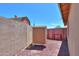 Enclosed backyard featuring a storage shed and privacy fence, creating an ideal outdoor living space at 5800 S College Ave, Tempe, AZ 85283