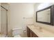 Bathroom featuring a vanity, mirror, and tiled shower with a shower curtain at 5800 S College Ave, Tempe, AZ 85283