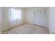 Bright bedroom with window and closet at 5800 S College Ave, Tempe, AZ 85283