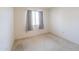 Bright bedroom with carpet and a window at 5800 S College Ave, Tempe, AZ 85283