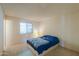 Bedroom featuring a window and bedside lighting at 5800 S College Ave, Tempe, AZ 85283