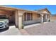 Close up on the tan siding of the home, showing the brick pillars at 5800 S College Ave, Tempe, AZ 85283
