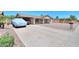 A wide driveway leads up to this single-story home with a covered carport at 5800 S College Ave, Tempe, AZ 85283