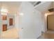 A hallway with closet space leads to the living room and kitchen at 5800 S College Ave, Tempe, AZ 85283