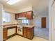 Cozy kitchen with vintage appliances and an open view to the living area at 5800 S College Ave, Tempe, AZ 85283