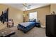Cozy bedroom with a full bed, carpeted floors, and large window at 7246 W Monte Cristo Ave, Peoria, AZ 85382