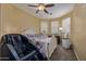 Bedroom with ceiling fan, carpeting, and a massage chair at 7246 W Monte Cristo Ave, Peoria, AZ 85382
