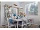 Dining room featuring a white table and chairs, stylish decor, and lots of natural light at 7246 W Monte Cristo Ave, Peoria, AZ 85382
