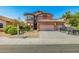Charming two-story home with a three-car garage, tile roof, and well-manicured landscaping at 7246 W Monte Cristo Ave, Peoria, AZ 85382