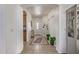 Bright foyer with neutral tile flooring, white walls, and decorative accents at 7246 W Monte Cristo Ave, Peoria, AZ 85382