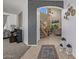 Inviting foyer with tiled flooring, staircase, and open access to a living room with high ceilings and natural light at 7246 W Monte Cristo Ave, Peoria, AZ 85382