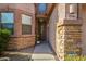 Inviting front entrance showcasing a decorative door, brick accents, and manicured landscaping at 7246 W Monte Cristo Ave, Peoria, AZ 85382