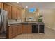 Spacious kitchen with stainless steel appliances, ample cabinet space, and an open layout to the adjacent living area at 7246 W Monte Cristo Ave, Peoria, AZ 85382