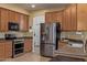 Well-equipped kitchen with stainless steel appliances, ample cabinet space, and modern countertops for cooking and entertaining at 7246 W Monte Cristo Ave, Peoria, AZ 85382