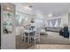 Open concept living room with ample seating, neutral carpet, and lots of natural light at 7246 W Monte Cristo Ave, Peoria, AZ 85382