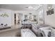 Open concept living room with dining area, neutral carpet, and lots of natural light at 7246 W Monte Cristo Ave, Peoria, AZ 85382