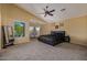Comfortable main bedroom with vaulted ceiling, large window, and seating area at 7246 W Monte Cristo Ave, Peoria, AZ 85382