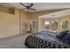 Comfortable main bedroom with vaulted ceiling, archway, and seating area at 7246 W Monte Cristo Ave, Peoria, AZ 85382