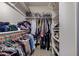 Spacious walk-in closet with ample storage space and organizational features at 7246 W Monte Cristo Ave, Peoria, AZ 85382
