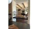 Open floorplan living room with fireplace, wooden beam ceiling, and modern decor at 9894 N 79Th Pl, Scottsdale, AZ 85258