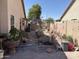 Outdoor backyard features a shed, fence, and decorative plants at 9911 W Riverside Ave, Tolleson, AZ 85353