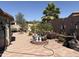Large backyard with decorative planters, brick pavers, and plenty of room for entertaining at 9911 W Riverside Ave, Tolleson, AZ 85353