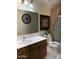 Well-lit bathroom featuring a shower-tub, stylish mirror, and neutral tones at 9911 W Riverside Ave, Tolleson, AZ 85353