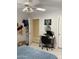 This bedroom is spacious and bright with a ceiling fan and good lighting at 9911 W Riverside Ave, Tolleson, AZ 85353