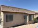 Exterior view of home highlighting the tile roof and spacious backyard at 9911 W Riverside Ave, Tolleson, AZ 85353
