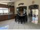 Bright kitchen featuring tile countertops, a stainless steel dishwasher, and breakfast nook area at 9911 W Riverside Ave, Tolleson, AZ 85353