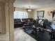 Open living room with neutral paint, with a fitness center. A perfect blend of comfort and convenience at 9911 W Riverside Ave, Tolleson, AZ 85353
