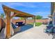 Outdoor living space with a covered patio and stylish furniture, perfect for entertaining in a private backyard at 9918 E Escondido Ave, Mesa, AZ 85208