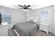 Bright bedroom with white walls, plantation shutters and two nightstands at 9918 E Escondido Ave, Mesa, AZ 85208