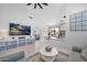 A bright and airy open floor plan that connects the living room to the dining and kitchen areas at 9918 E Escondido Ave, Mesa, AZ 85208