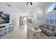 Open concept space with living, dining, and kitchen areas, showcasing bright and modern design at 9918 E Escondido Ave, Mesa, AZ 85208