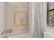 This refreshed bath features a shower-tub combination with tile accents and updated hardware at 10410 N Cave Creek Rd # 2229, Phoenix, AZ 85020