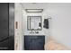 The bathroom features a black vanity, modern fixtures, and stylish mirror at 10410 N Cave Creek Rd # 2229, Phoenix, AZ 85020