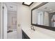 Well-lit bathroom features modern fixtures, a sleek vanity, and a bathtub with updated tiling at 10410 N Cave Creek Rd # 2229, Phoenix, AZ 85020