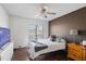 Cozy bedroom with a large window and dark wood floors at 10410 N Cave Creek Rd # 2229, Phoenix, AZ 85020